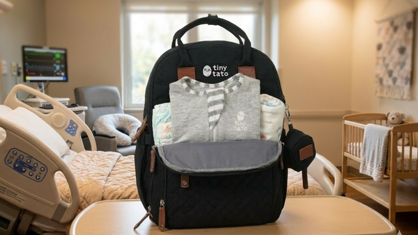 TatoWrap bamboo zip swaddle packed inside a Malaysian hospital bag — compact newborn swaddle ideal for private hospital birth bag, dual zip shown | tinytato.com