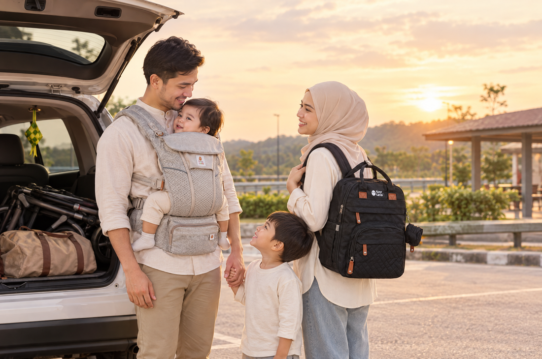 Malaysian family at a highway rest stop with a baby in a TatoSnug carrier and a black TatoNest diaper backpack, car boot open