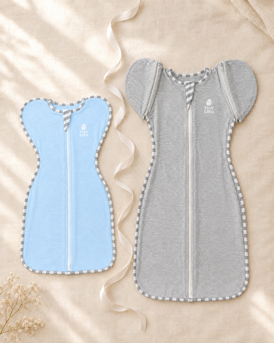 TatoWrap in Baby Sky next to TatoWrap+ in Cloud Grey with zip-on sleeves